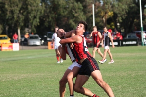 Jake Hammond fights in the ruck against his North Ringwood opponent (photo: Davis Harrigan)